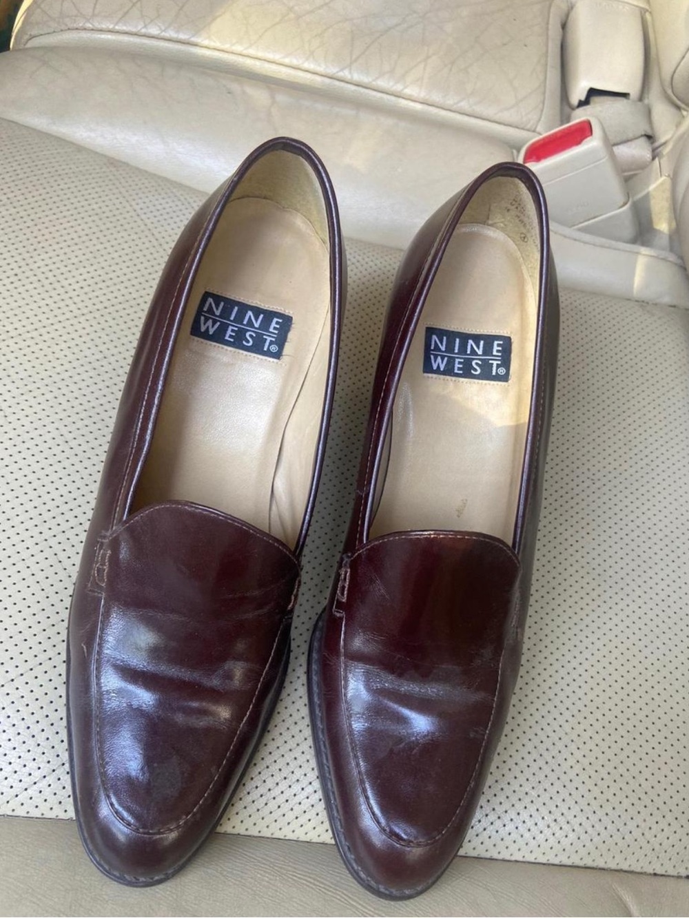 Black leather Nine West loafers with a classic design